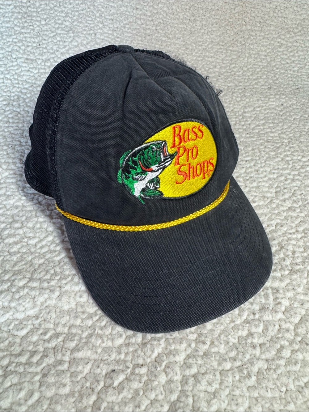 Bass Pro Shops Black Trucker Cap with Yellow Patch and Rope